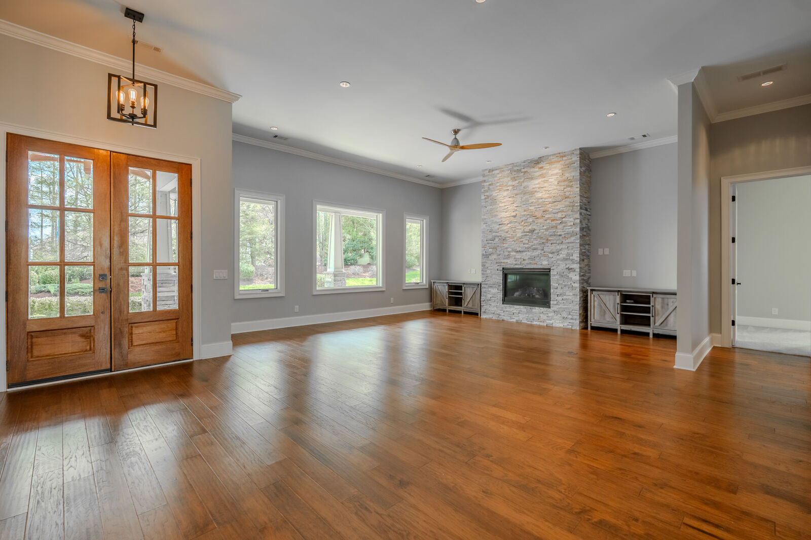Great room with a floor-to-ceiling stone fireplace at 38 The Cliffs Parkway